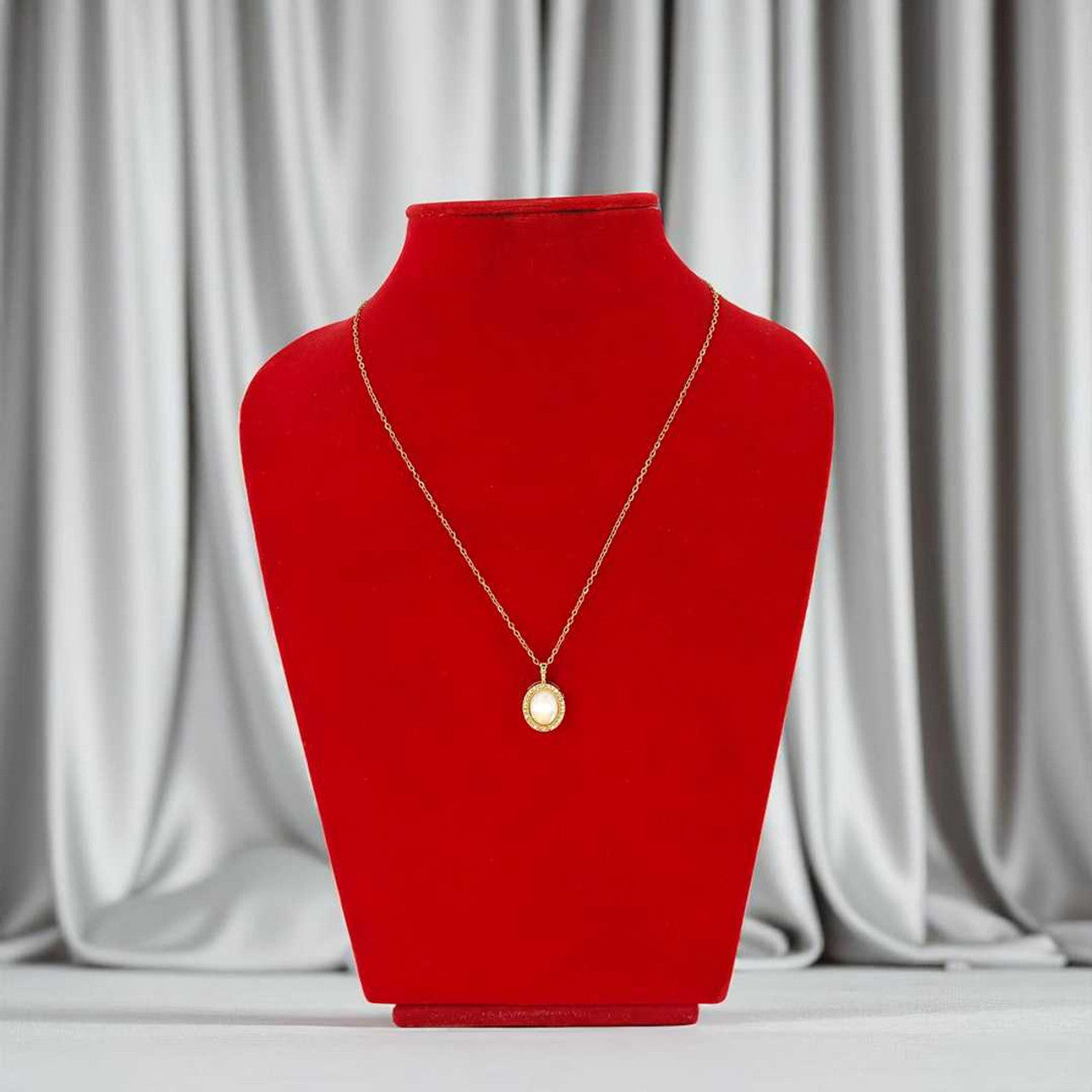 Oval Gold Pendant with White Stone