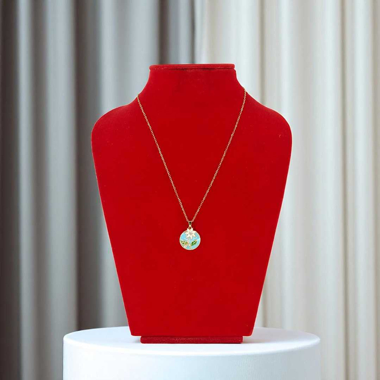 Golden Pendant with White Flower Design