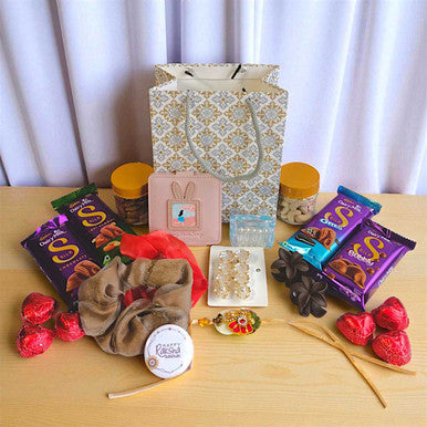 Rakhi Gift for Sister with Chocolates & Accessories